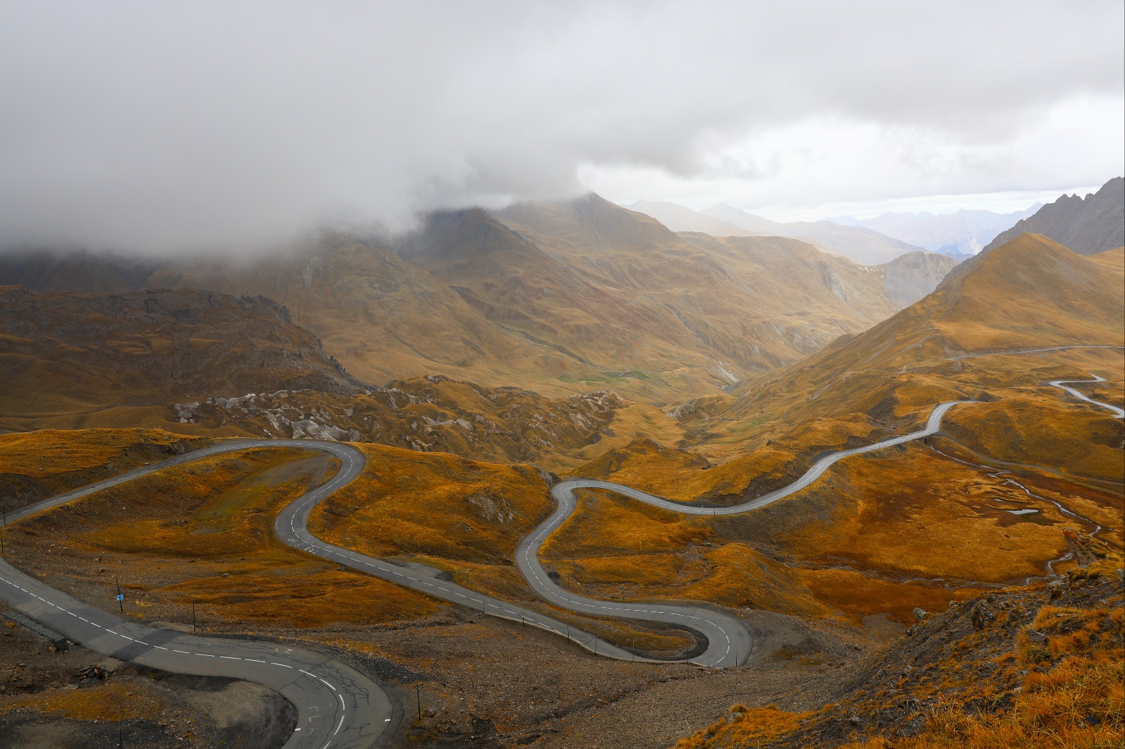 Scenic mountain driving road through autumn landscape